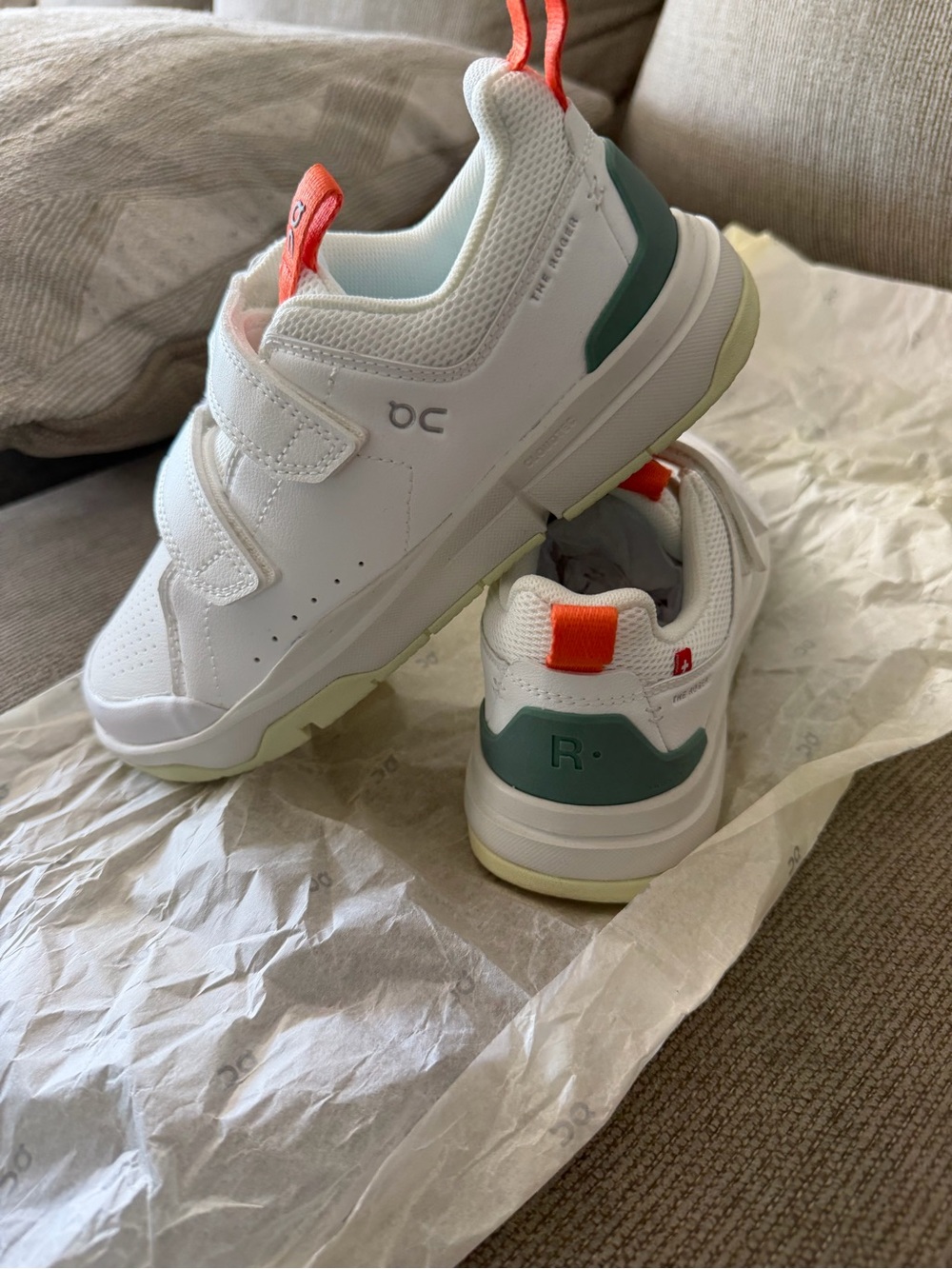 On Running Kids White Sneakers with Teal Accents and Coral Pull Tabs